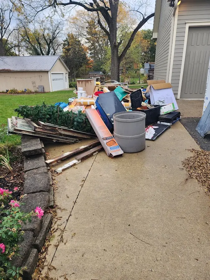 Dumpster being loaded with debris for 30 Yard Dumpster Rental in Winnsboro